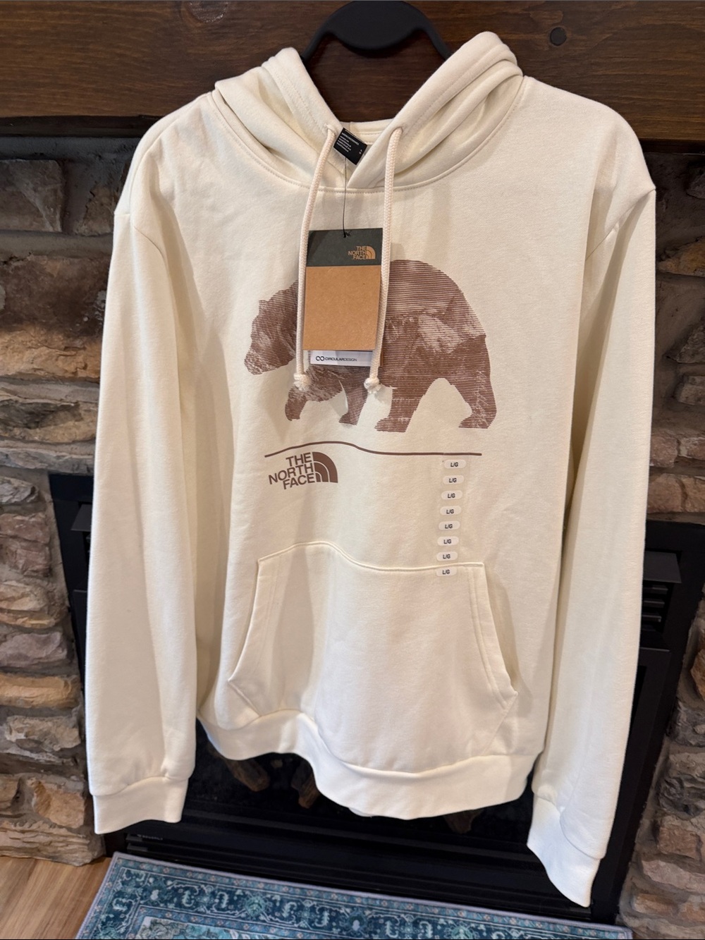 The North Face Cream Hoodie with Brown Bear Graphic